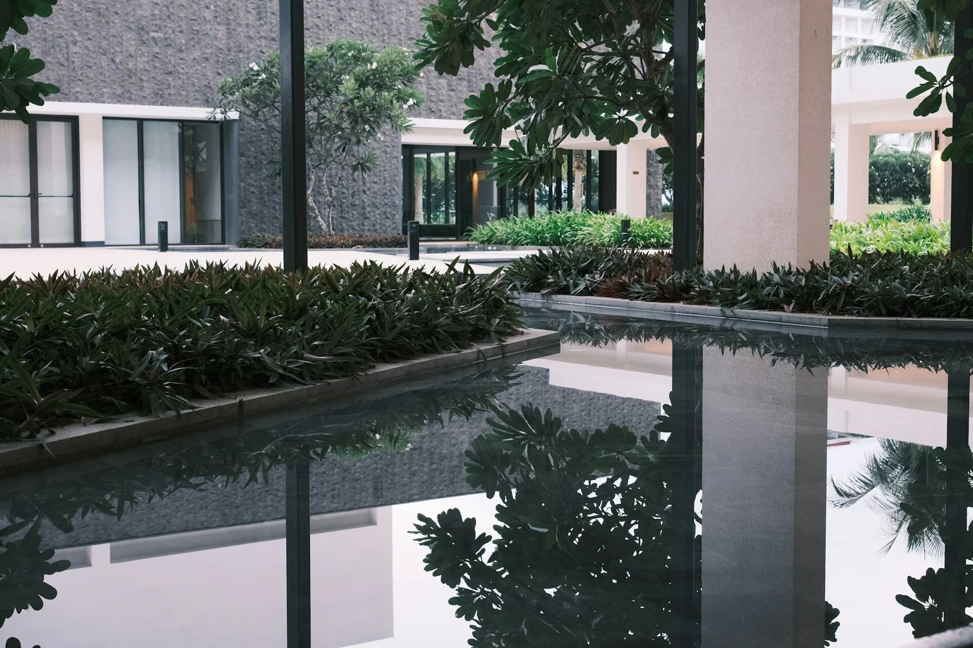 Stone detailing and a water feature in a landscaped outdoor space